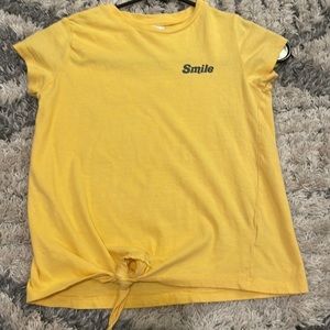 gold smiley shirt